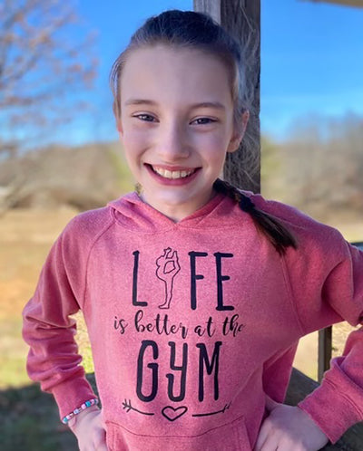 Girl Wearing Life Is Better At The Gym Youth Hoodie Pomegranate