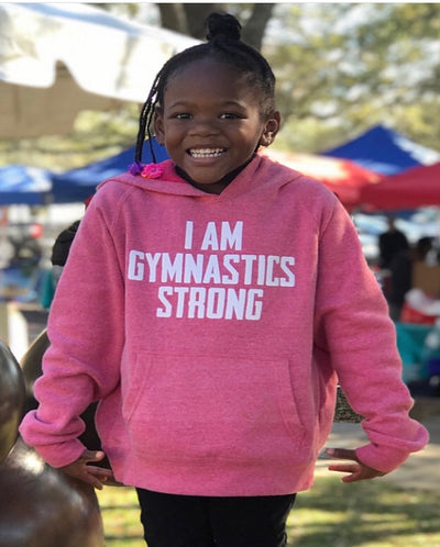 Girl Wearing I Am Gymnastics Strong Youth Hoodie Pomegranate